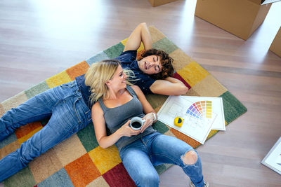 High angle view of couple sitting at home