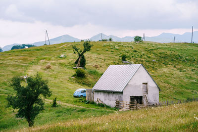 House on field against sky