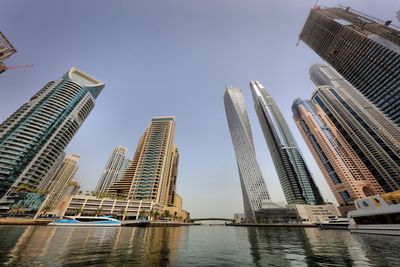 Low angle view of modern buildings against clear sky