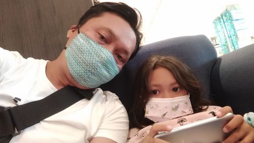 Portrait of a smiling young woman using mobile phone