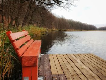 Pier over lake against sky