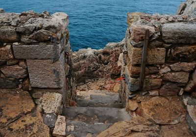 Old stone wall by sea