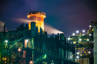 Illuminated buildings in city at night