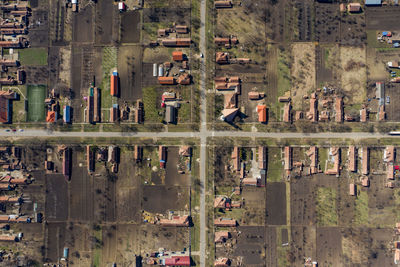 Aerial drone view of a road intersection in the village