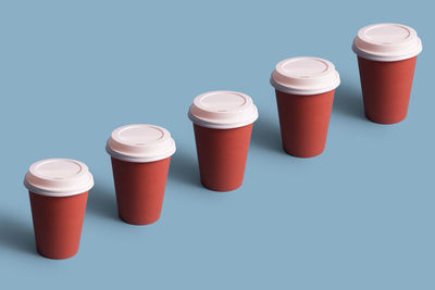 High angle view of coffee cups on table