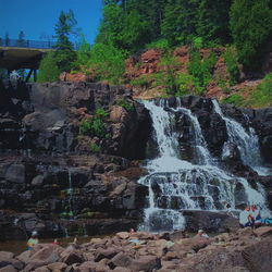 Scenic view of water flowing through rocks