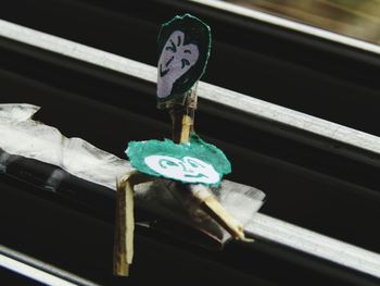 High angle view of information sign hanging on metal