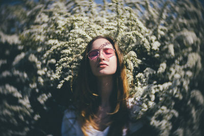 Portrait of young woman in sunglasses