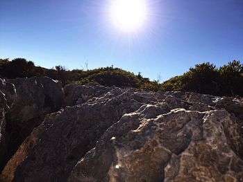 Scenic view of rocks against clear sky