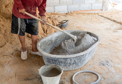 Low section of man working in workshop