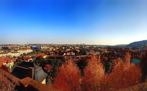 High angle shot of townscape against blue sky