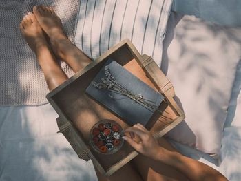 High angle view of woman reading book