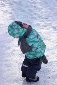 Man wearing hat on field during winter