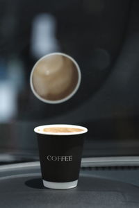 Close-up of coffee cup on table