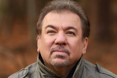 Close-up portrait of man looking away