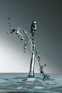 Close-up of splashing water against white background