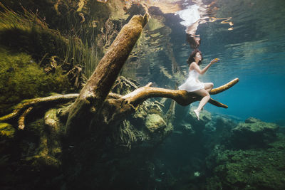 Woman swimming in sea