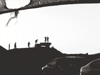 People on road against clear sky