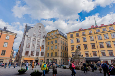 People in city against sky