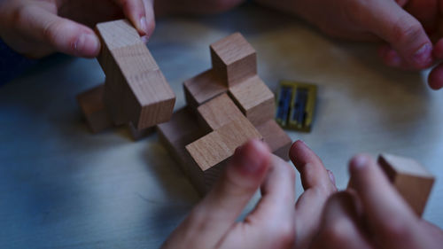 High angle view of people playing piano on table