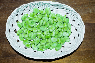 High angle view of vegetables in basket on table