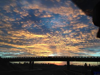 View of bridge against cloudy sky