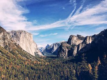 Scenic view of mountains against cloudy sky