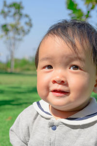 Portrait of cute boy in garden