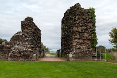 View of old ruin building in field