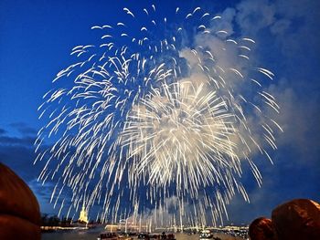 Low angle view of firework display at night