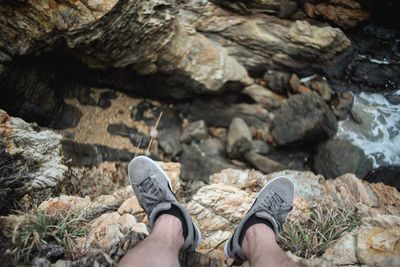 Low section of person on rock