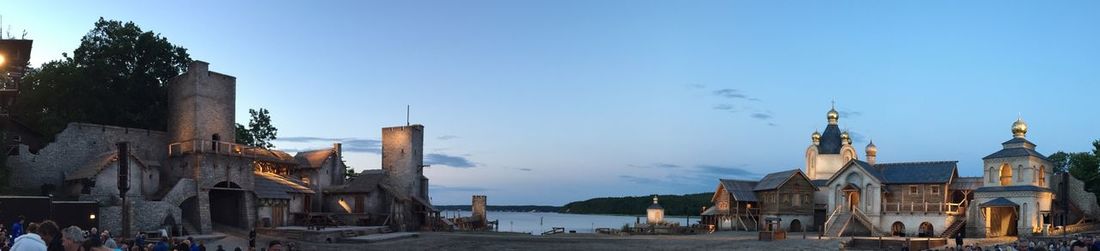 Buildings against clear blue sky