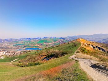 Scenic view of landscape against clear blue sky