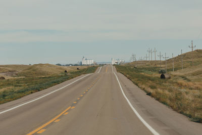 Farm to marked road, silo, town, small