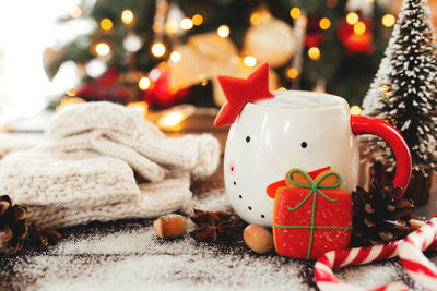 Christmas still life with cup of coffee, cookie and decorations. high quality photo