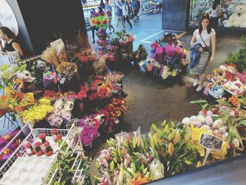 Various flowers for sale at market stall