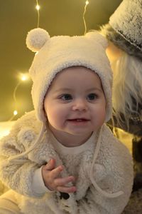 Close-up portrait of cute girl wearing knit hat