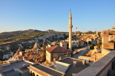 High angle view of buildings against blue sky