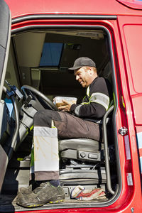 Truck driver having lunch break