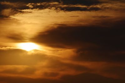 Low angle view of dramatic sky during sunset