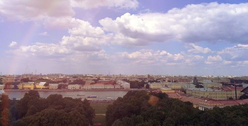 Buildings against cloudy sky