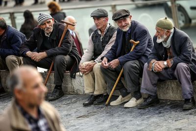 Group of people sitting outdoors