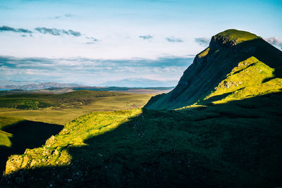 Mountain top on the isle of skye in late afternoon sun with long shadows