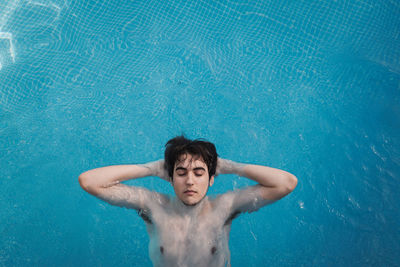 High angle view of man swimming in pool