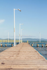 View of pier on sea against sky