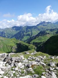 Scenic view of landscape and mountains against sky