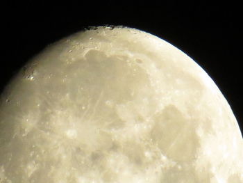 Close-up of moon over black background