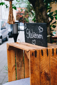 Text on wooden planks outdoors