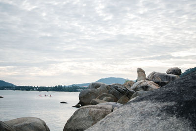 Rocks on beach against sky