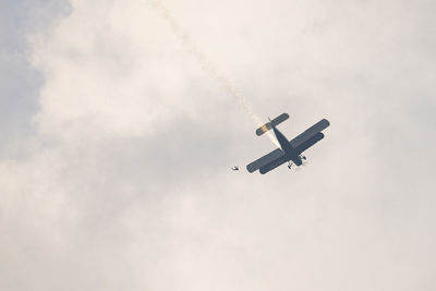 Low angle view of airplane flying in sky